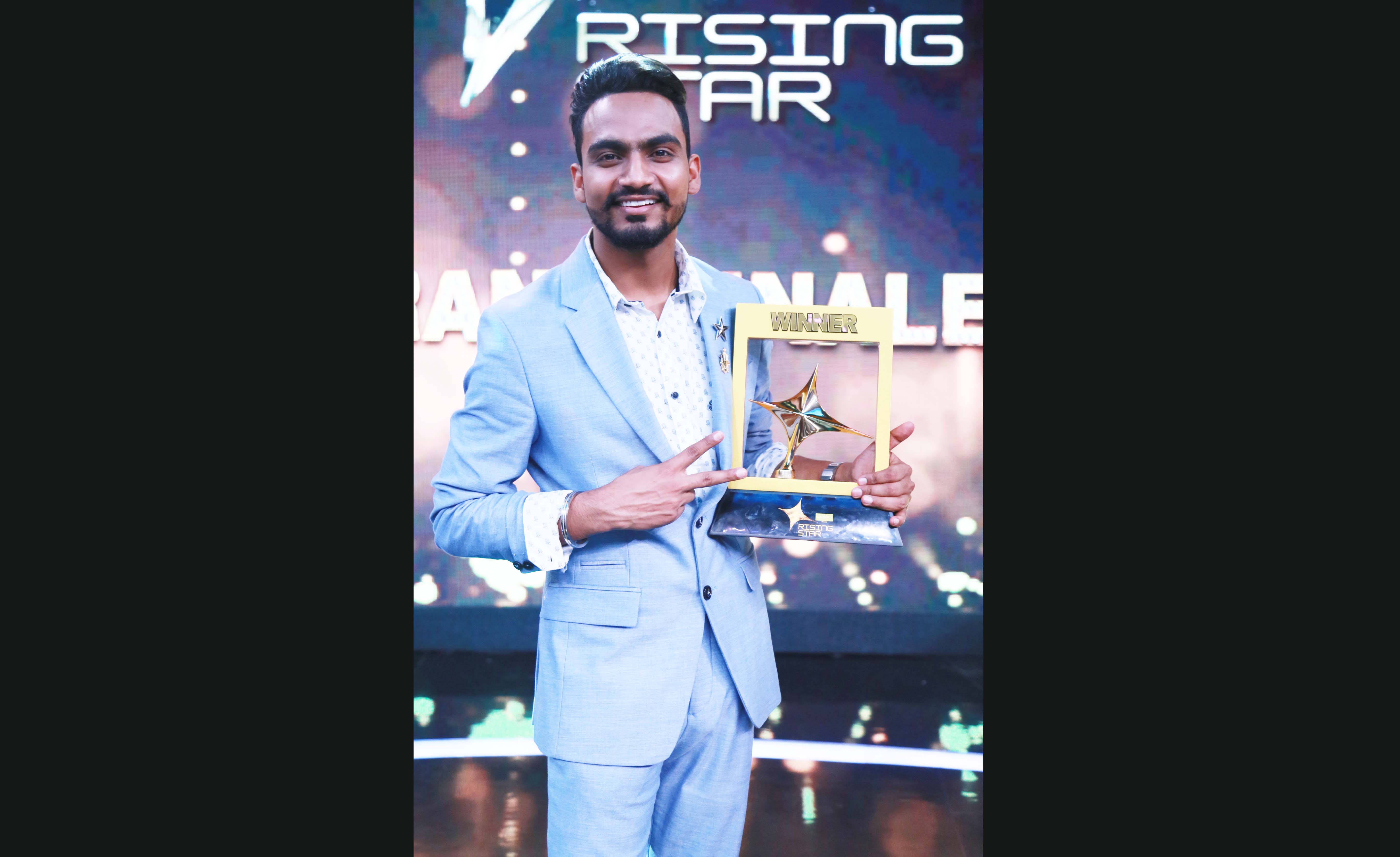 Rising Star winner Bannet Doasanjh with his trophy